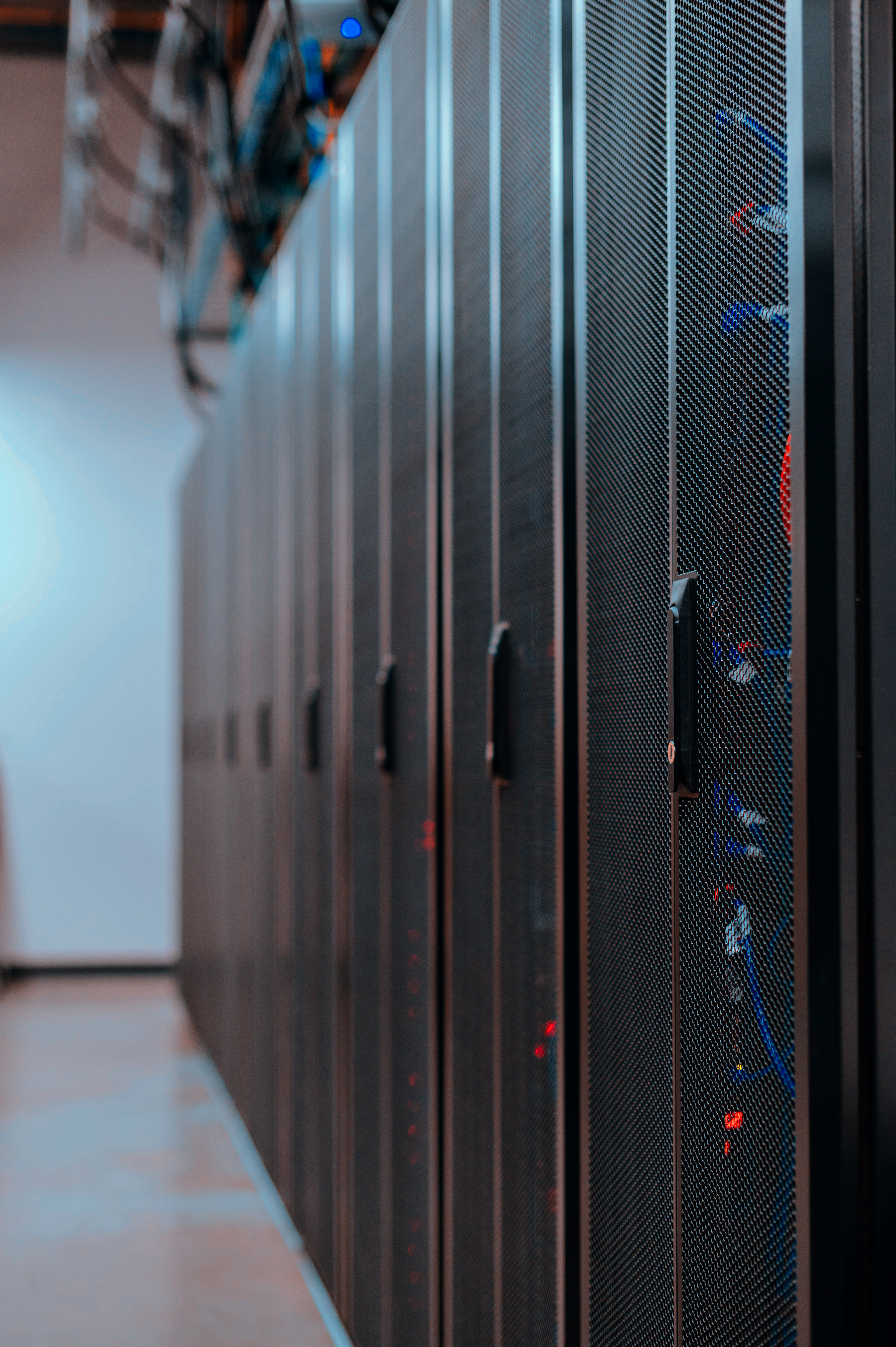 row of computer servers in a room